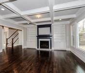 Open Living w Coffered Ceilings & Built-ins in this Brookhaven home built by Waterford Homes